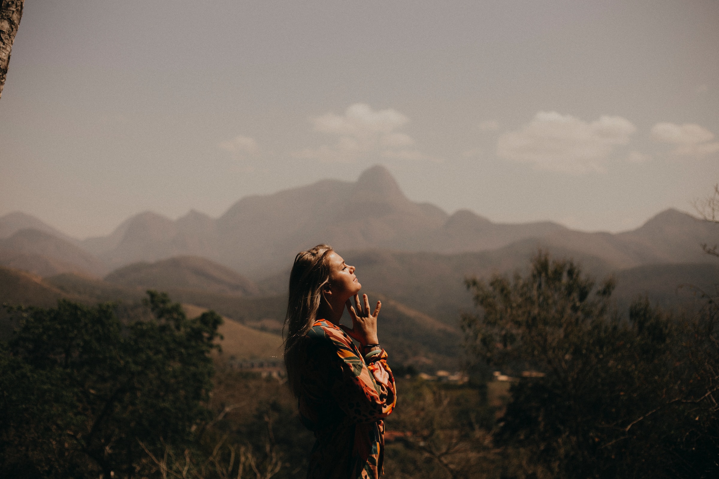 Woman standing with mountains in the background