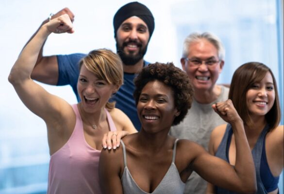 A diverse group of men and women working out together.